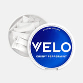 VELO Crispy Peppermint nicotine pouches container on a black background