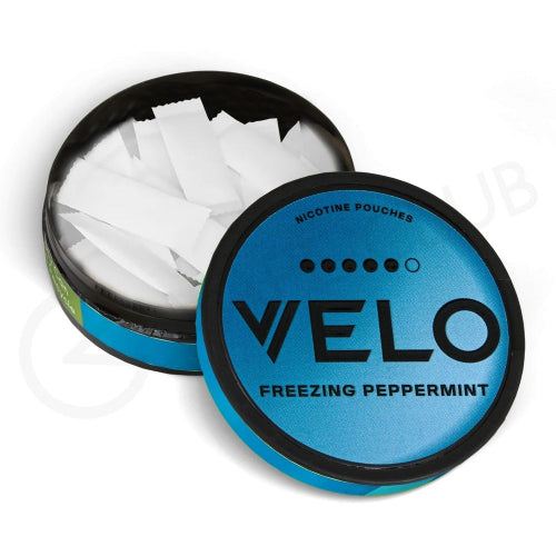 Open container of VELO freezing peppermint nicotine pouches on a white background